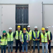 Group of Chilean engineers pose for a photo in-front of a battery storage 麻豆色情片鈥檚 Moss Landing Energy Storage Facility